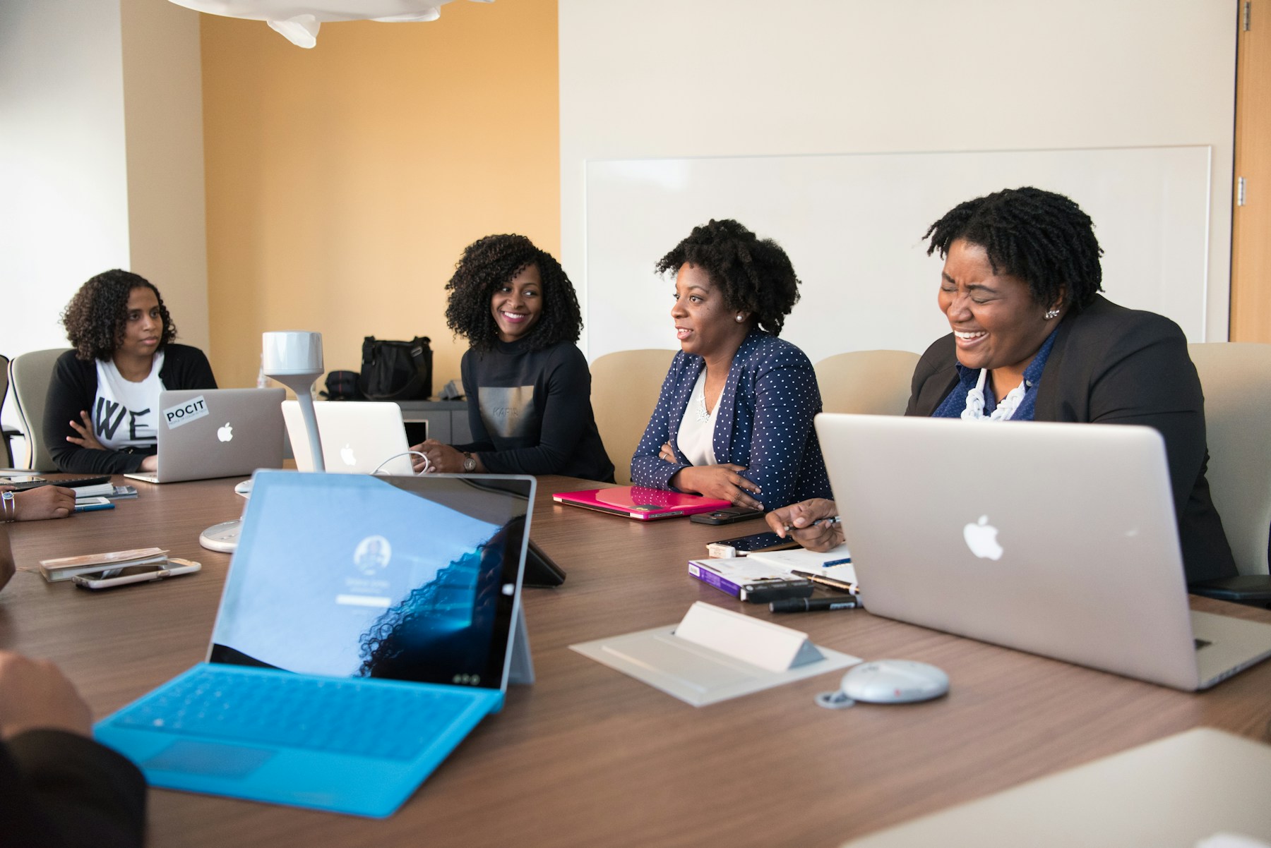 Women sharing ideas around a table
